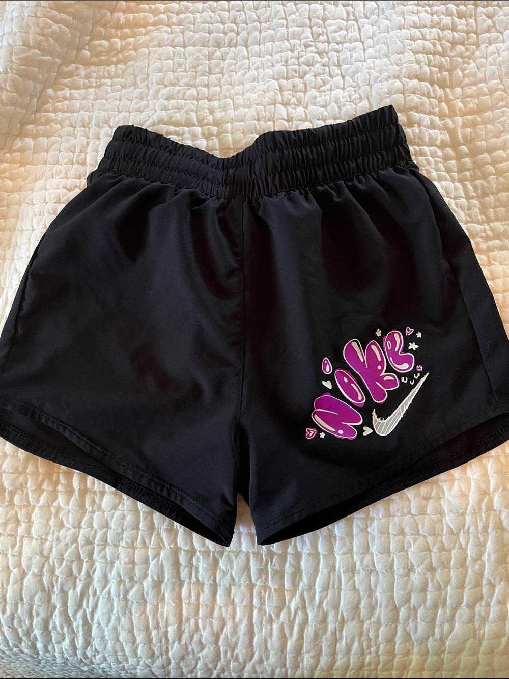 Nike Girl’s Black Athletic Shorts with Pink Graffiti Logo